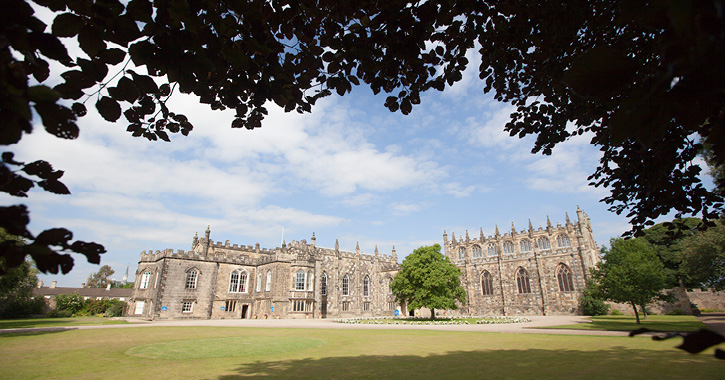 View of Auckland Castle and surrounding grounds on a bight sunny day